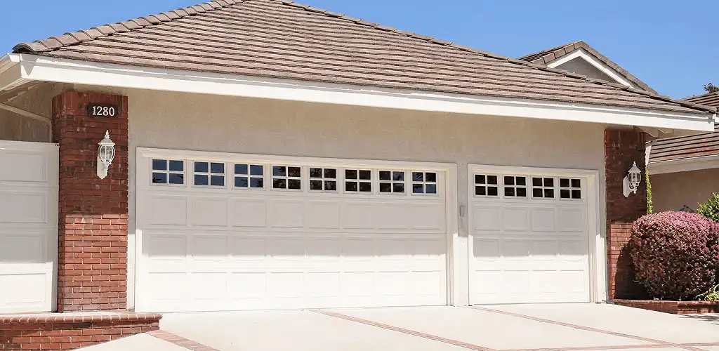 Residential garage door repair service for a double garage door in New Haven, CT