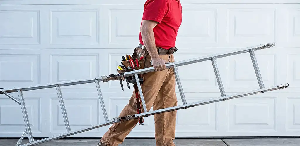 Garage door repair technician arriving with tools and ladder in New Haven, CT