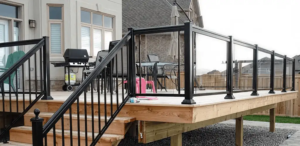 Handrail installation on a deck staircase for safety and code compliance in New Haven, CT